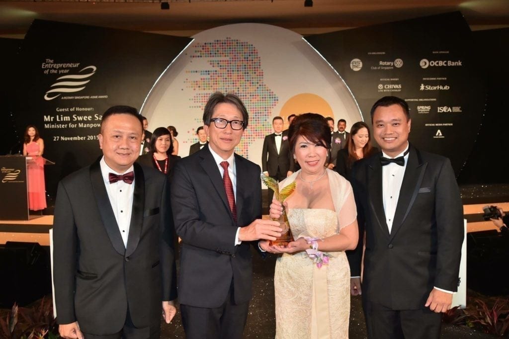 Mdm Bee Choo Receiving Award Presented by Minister Lim Swee Say